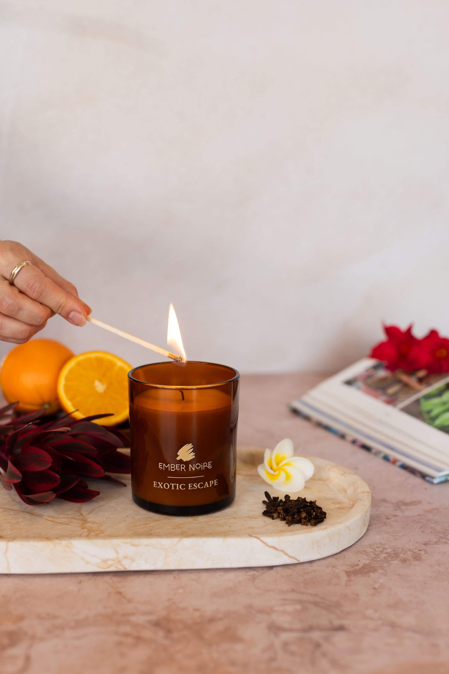 Exotic Escape candle – amber jar styled with citrus slices – natural soy candle with energising essential oils