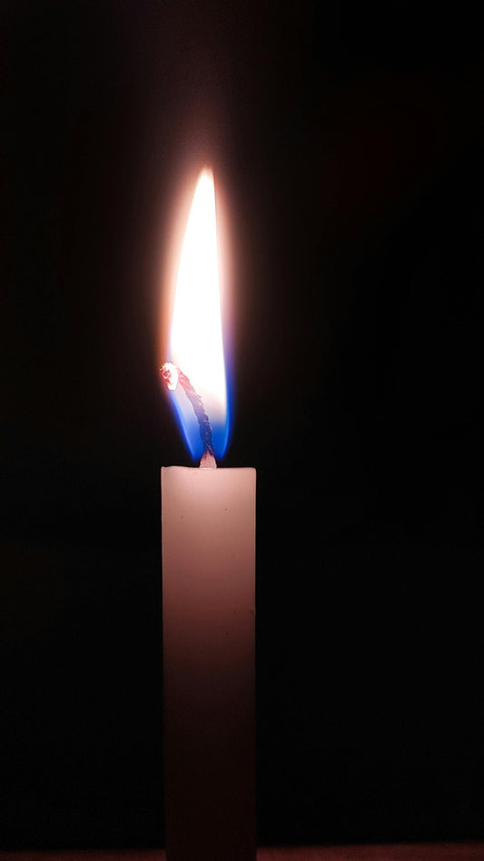 Serene soy wax candle flame burning softly — why natural soy wax matters