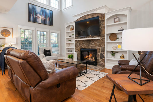 Cozy low-tox home living room with warm candlelight and natural decor