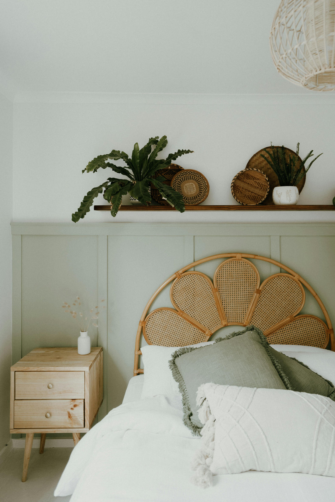 Soft white pillows on a bed ready for a non-toxic lavender sleep spray ritual