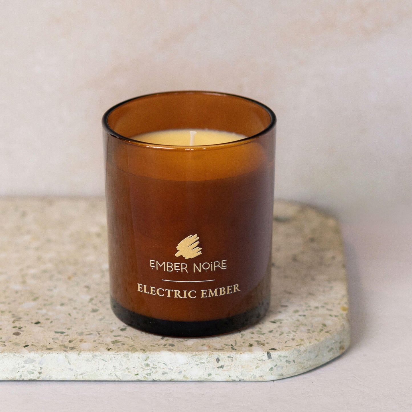 Electric Ember Candle –  spices and warm light – bold and spicy aromatherapy soy candle on marble slate 