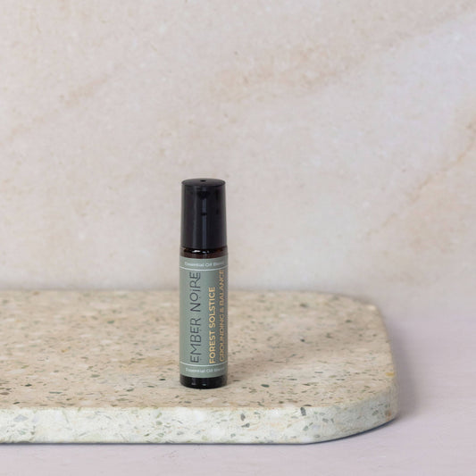 Aromatherapy roller bottle Forest Solstice on Marble tile 