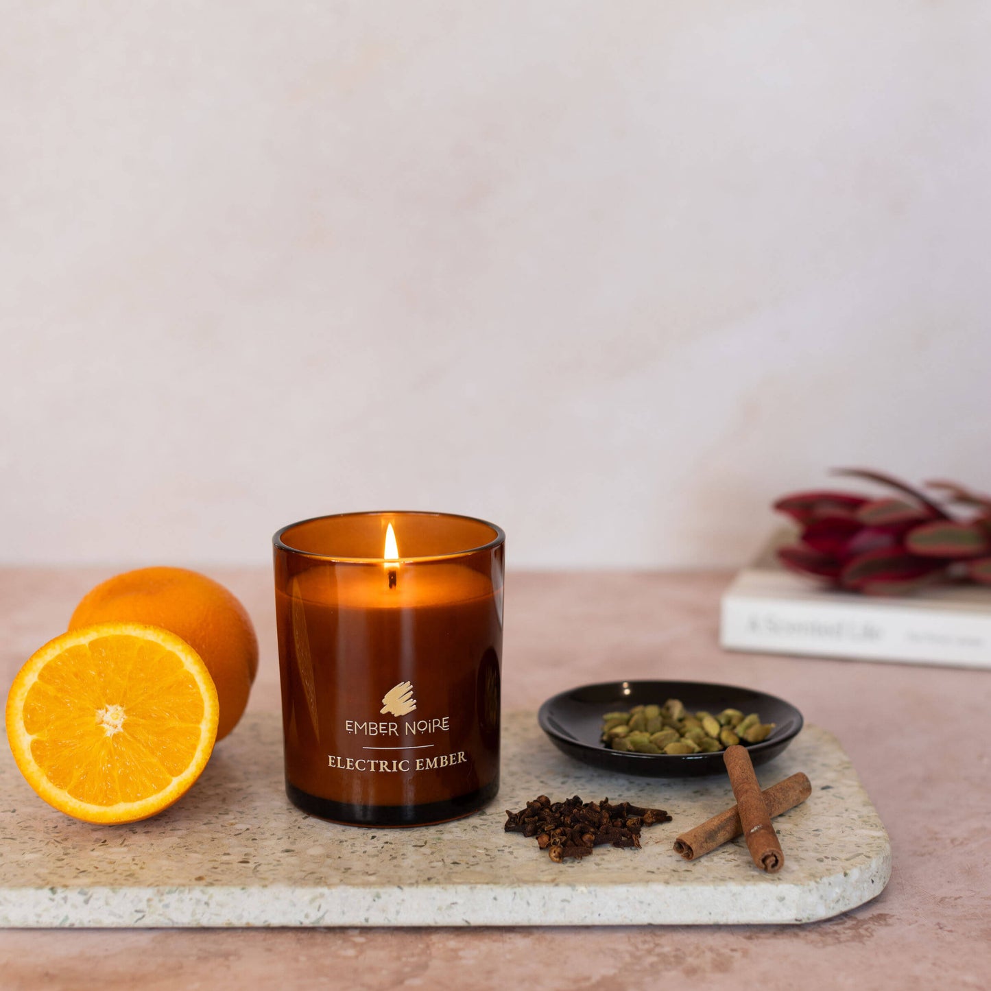 Electric Ember Candle – styled with spices and warm light – bold and spicy aromatherapy soy candle styled with cinnamon sticks, organes, cloves and cardmom 