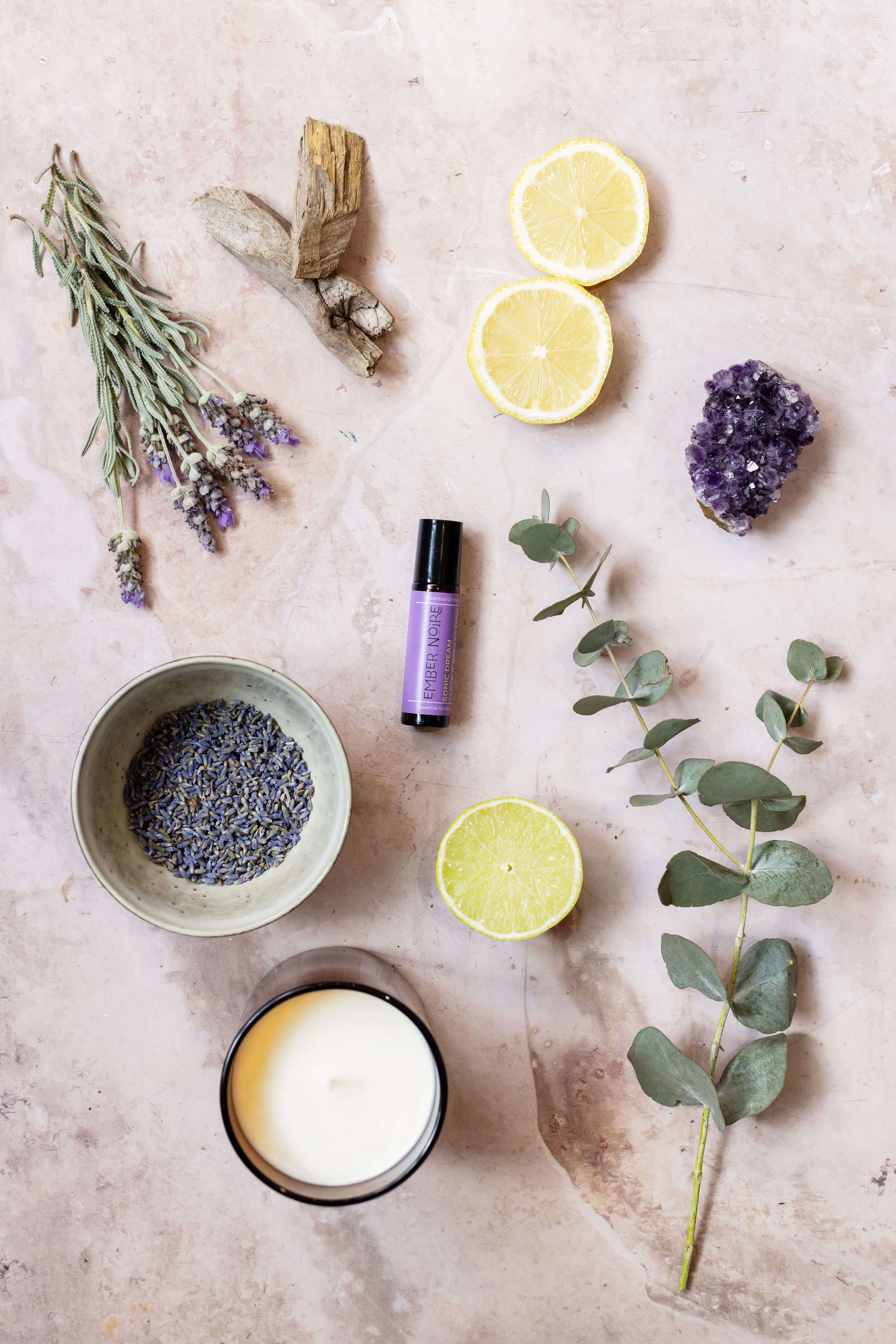 Sleep Aid Aromatherapy pulse point roller flatlay with lavender, eucalyptus and bergamot and scented soy candle 