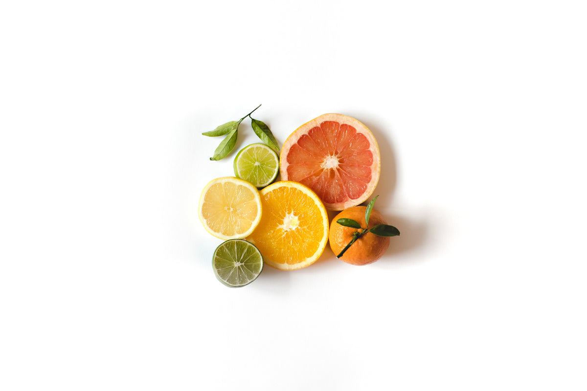 Fresh citrus fruit bunch with bright lemon and orange, key scent inspiration for Ember Noire Lemon Twist collection