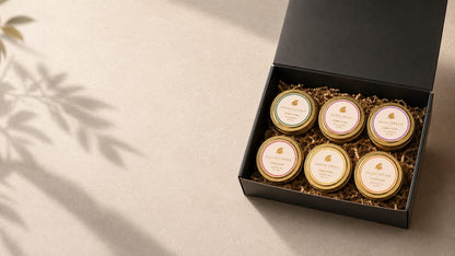 Ember Noire luxury candle discovery set banner, six hand-poured low-tox mini candles in an open black box