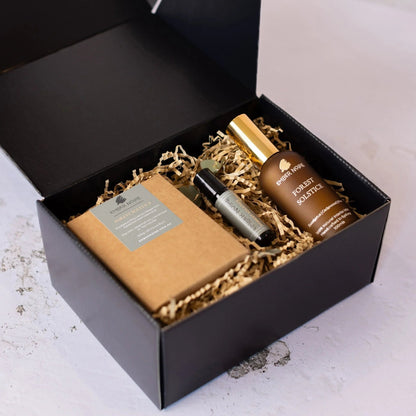 Wellness gift set featuring grounding aromatherapy candles by Ember Noire